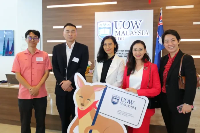 HIBAM’s core collaborators pose with UOW Malaysia’s kangaroo mascot, symbolizing the program’s blend of local impact and global vision.